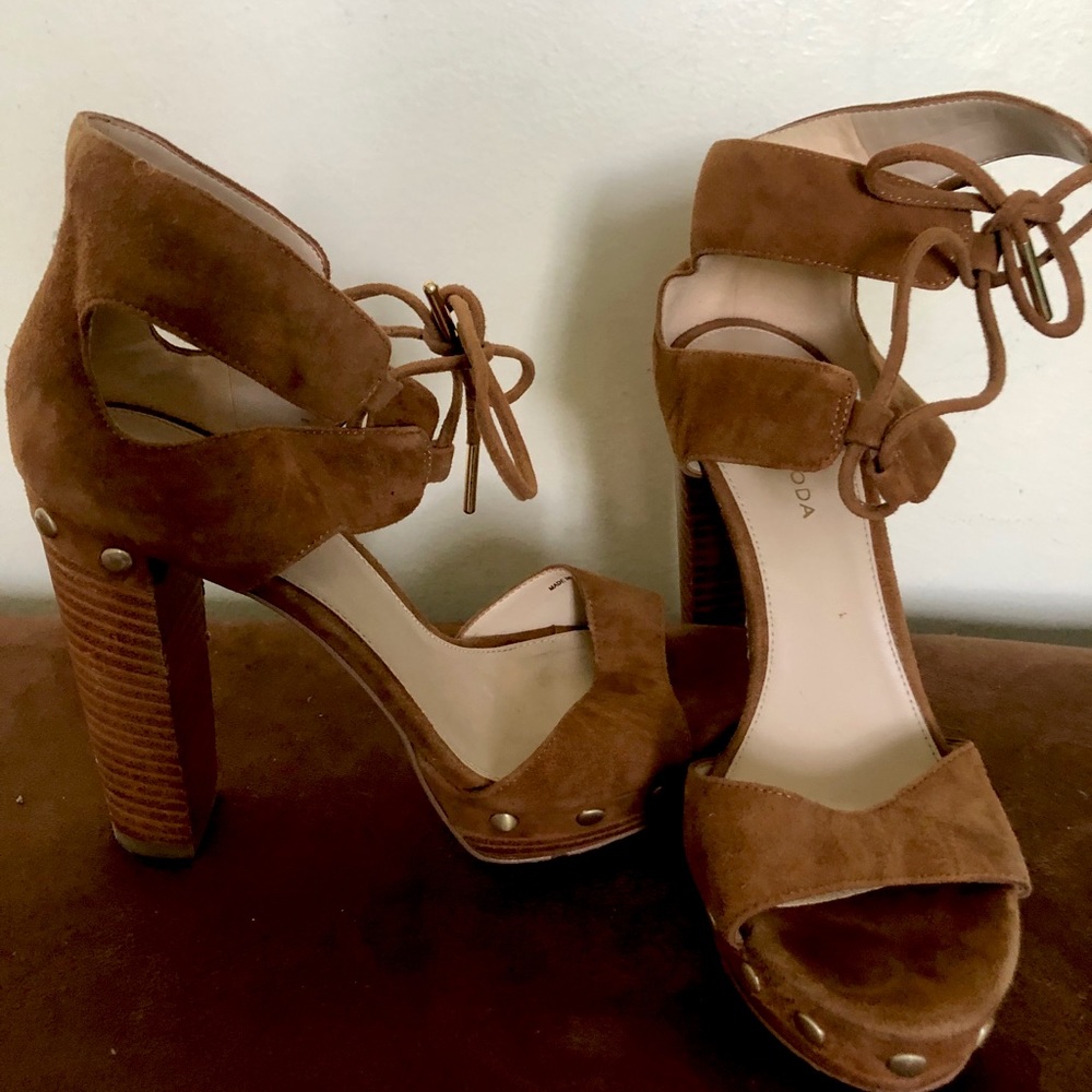 Brown block heels with crisscross shoelace ties
